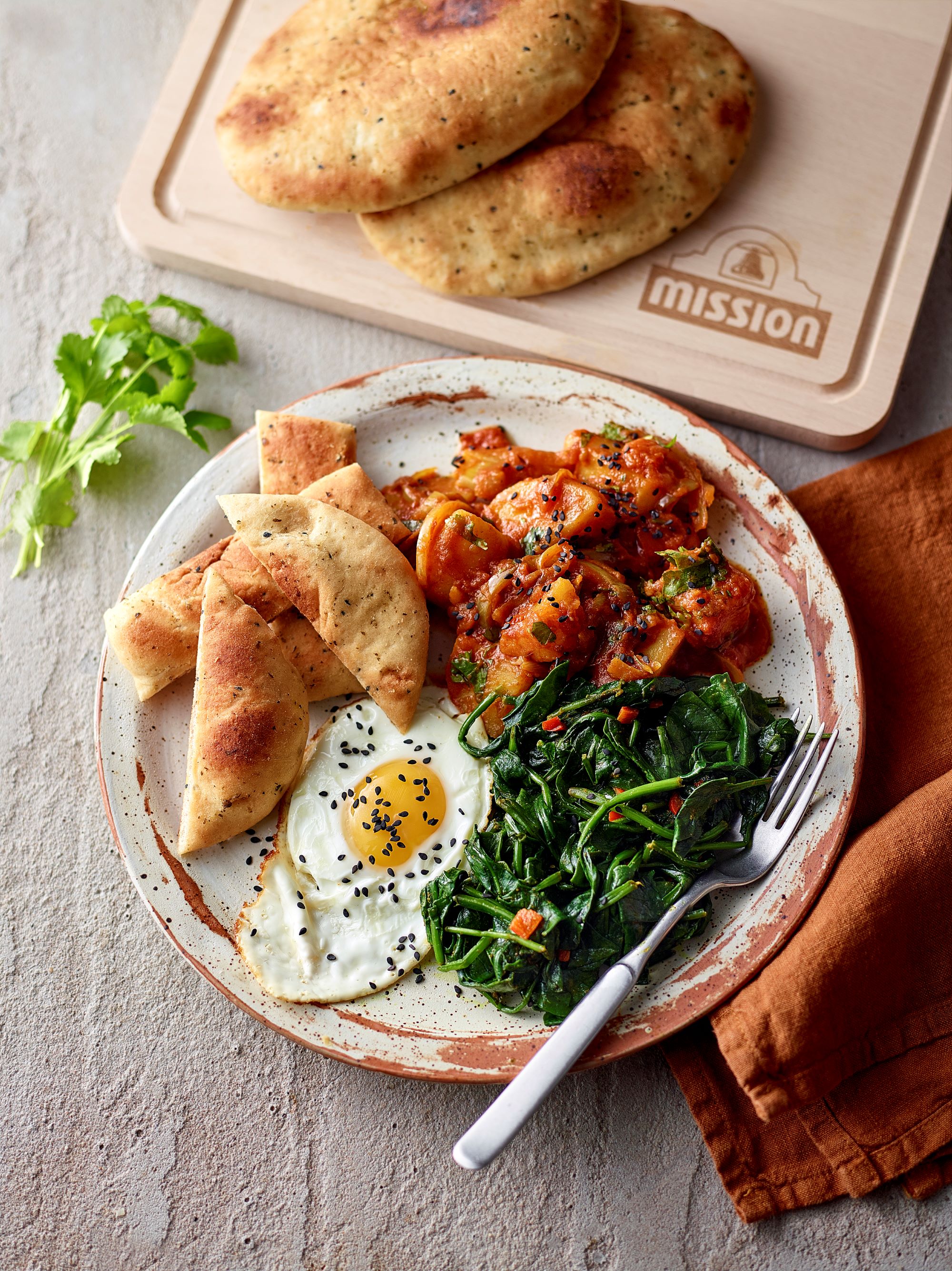 Indian Eggs with Naan Soldiers, Bombay Potatoes and Saag